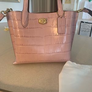 Coach purple ice purse.  New without tags.  Never used.